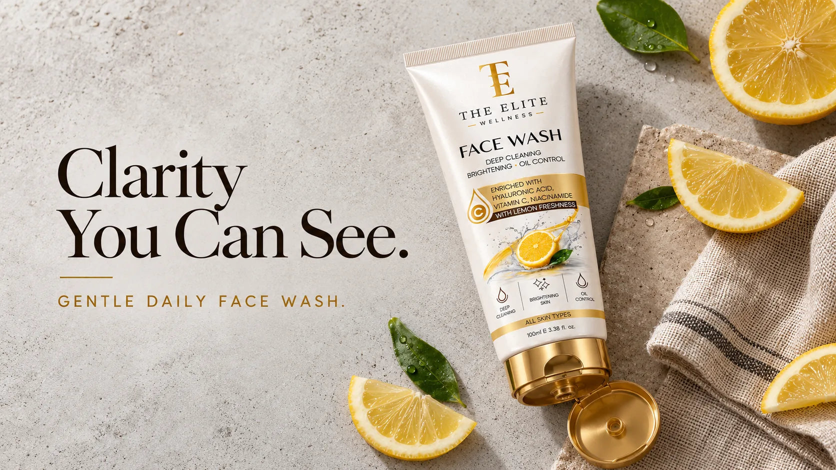 Clarity You Can See. Gentle Daily Face Wash. The Elite Wellness Face Wash on concrete with lemon slices.