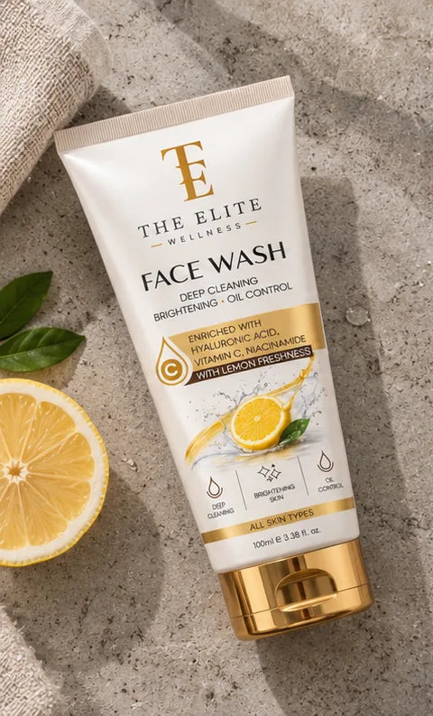 The Elite Wellness Face Wash on concrete with a lemon slice